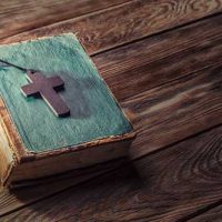 bigstock-Christian-cross-on-bible-105120932